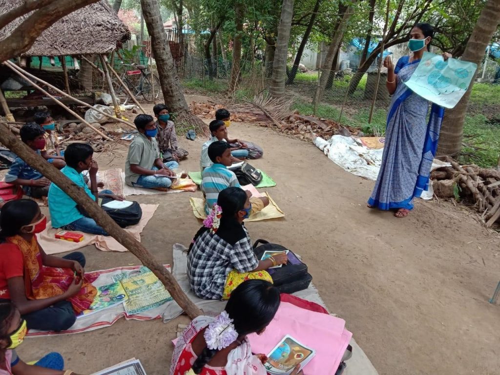 Mrs. Kavitha teaching her hope children