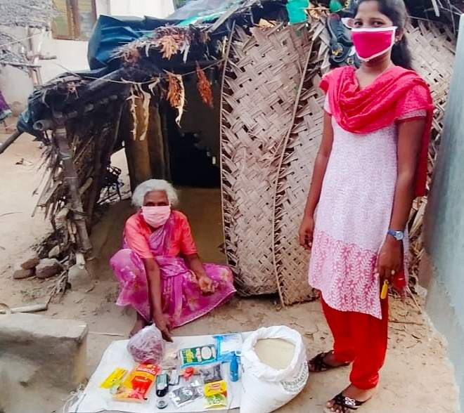 Ms. Pushpavalli receving a Hope for the Elderly rationing kit