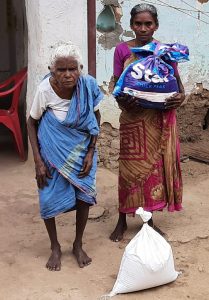 Periyakka and her daughter receiving Hope for the Elderly rationing kits.