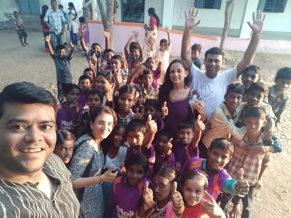 Hope Sponsor Krishna Bhaavin Shah taking a selfie with Hope Children at Hope Learning Stations