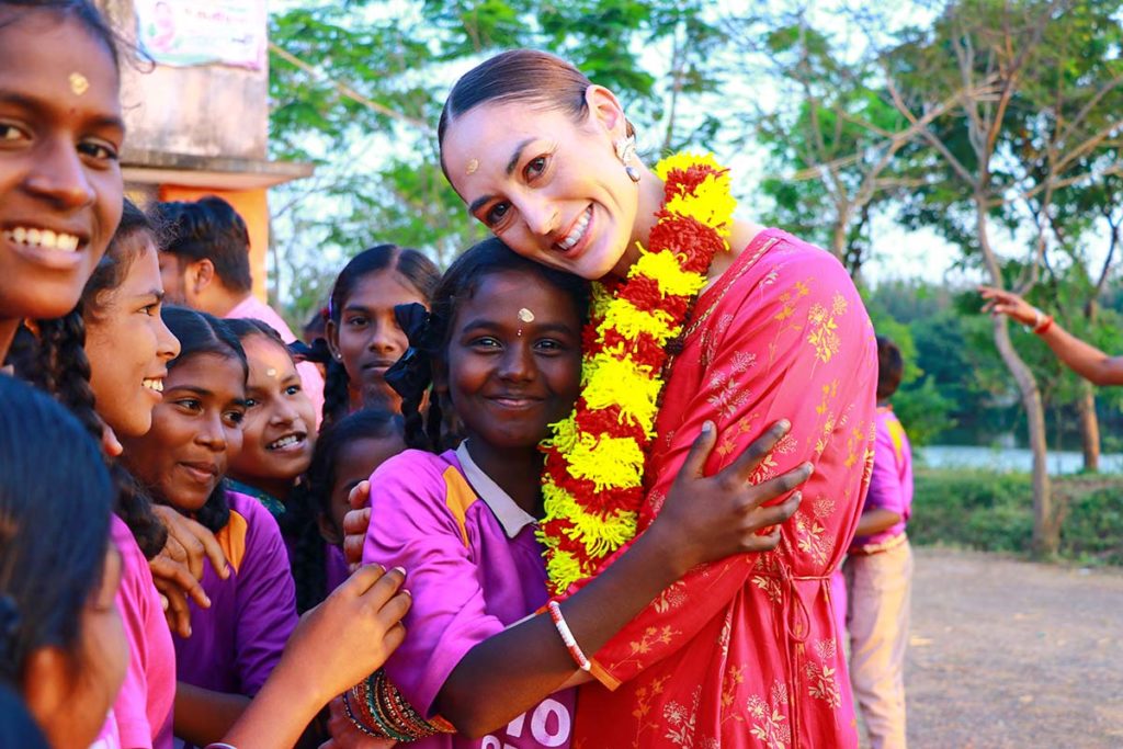 Hope sponsor hugging Hope children